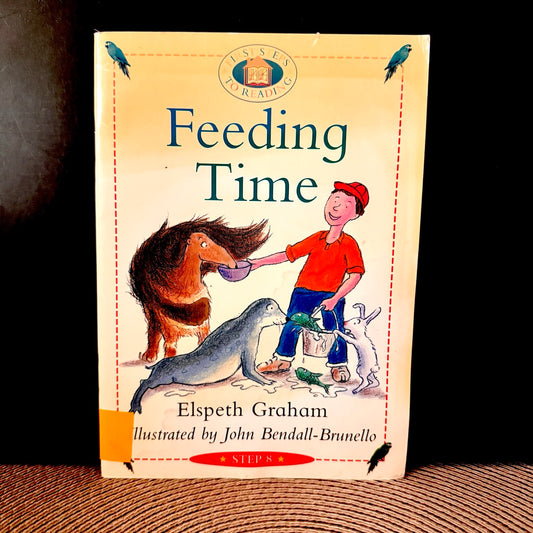 Book titled 'Feeding Time' with illustrations of a boy and animals on the cover.