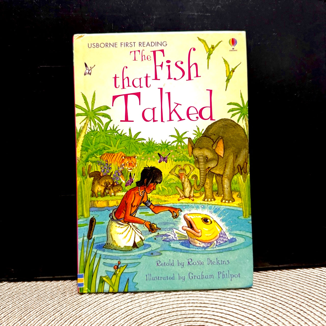 'The fish that talked' cover with a large fish in a pond and a boy standing next to it.