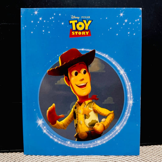 Toy Story book cover with Woody on a blue background