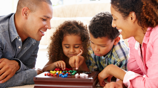 Family playing board game together