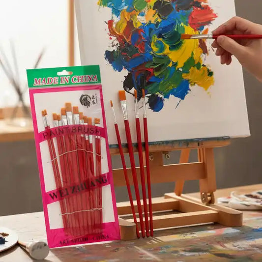 a pack of paint brushes and a hand painting on a canvas with one of the brushes