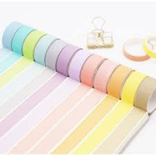 Set of colorful washi tape rolls on a white background