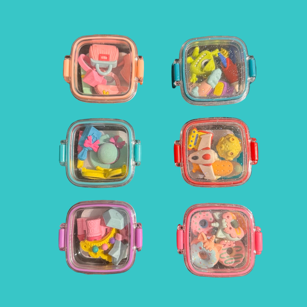 6 eraser boxes on a teal background