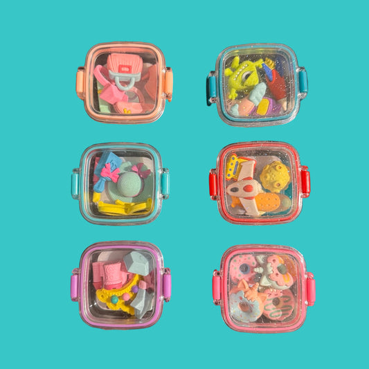 6 eraser boxes on a teal background