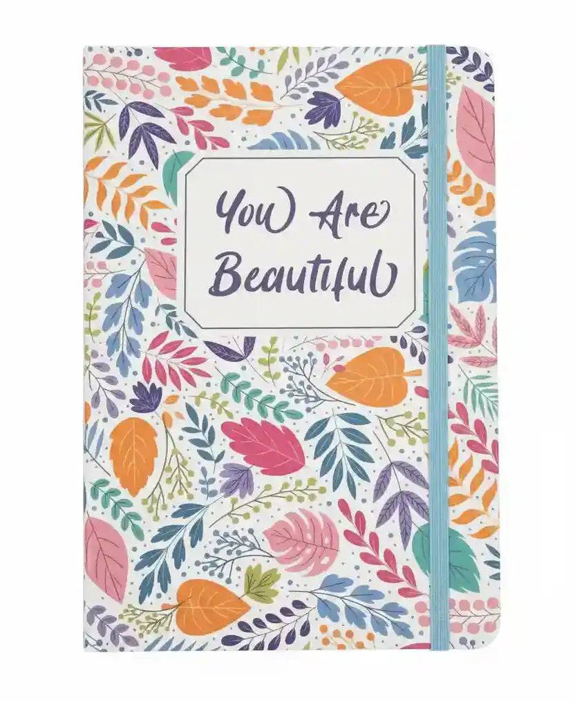Notebook with colorful leaf pattern and 'You Are Beautiful' text on a white background
