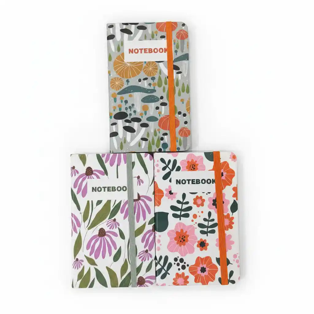Three notebooks with floral designs on a white background