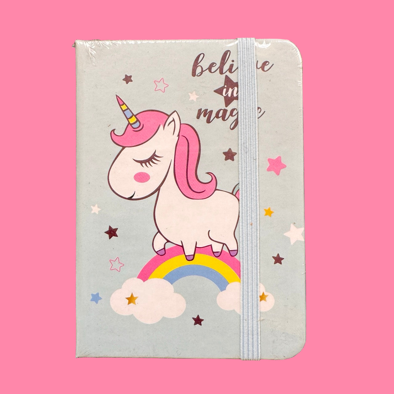Notebook with a unicorn design on a pink background