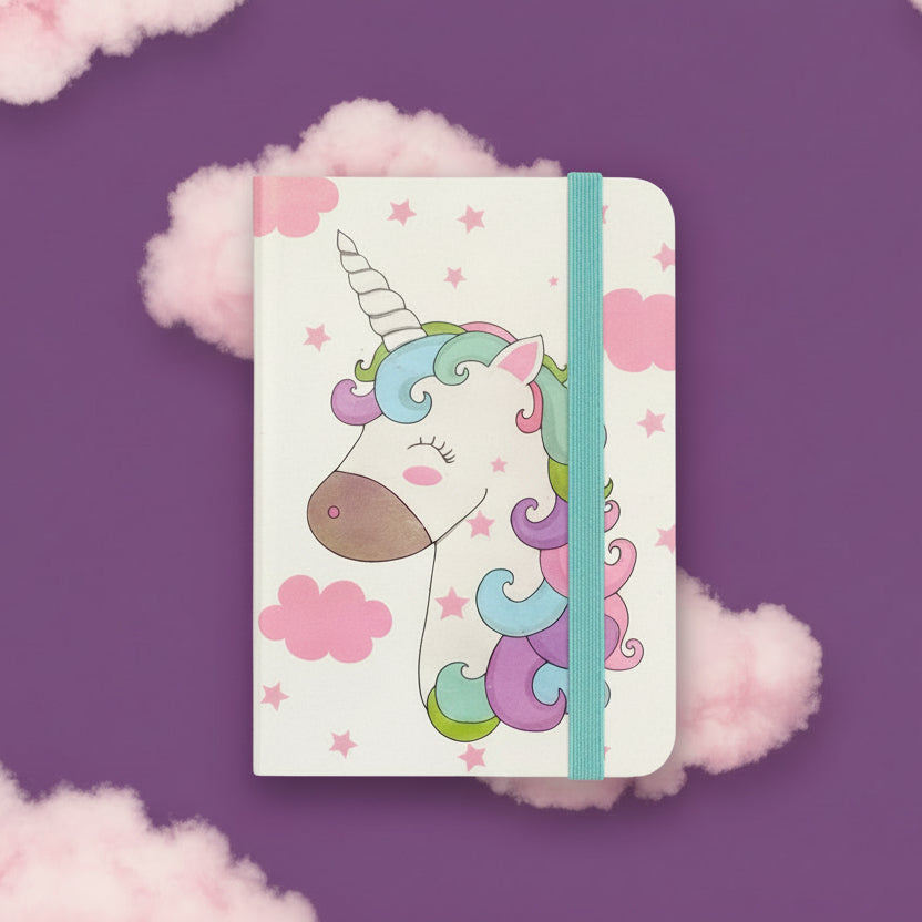 Notebook with a unicorn design on a purple background with pink clouds