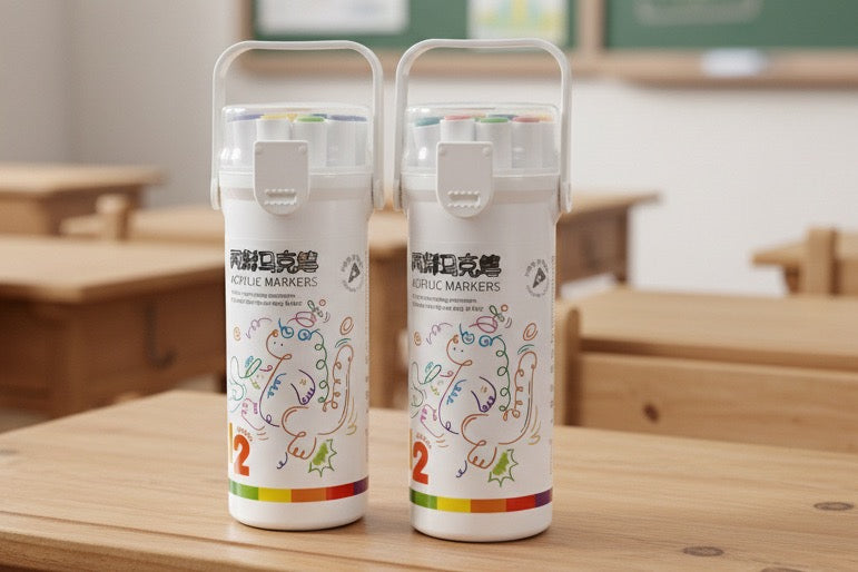Two white markers with colorful designs on a wooden surface, likely in an educational setting.