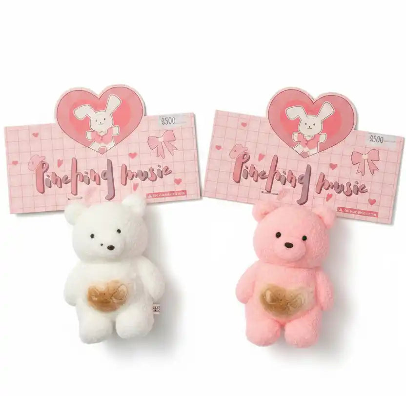 Two plush toys, one white and one pink, with heart designs on a white background.