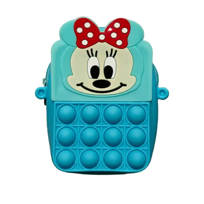 Blue pop-it fidget toy with a cartoon face and red bow on a beige background