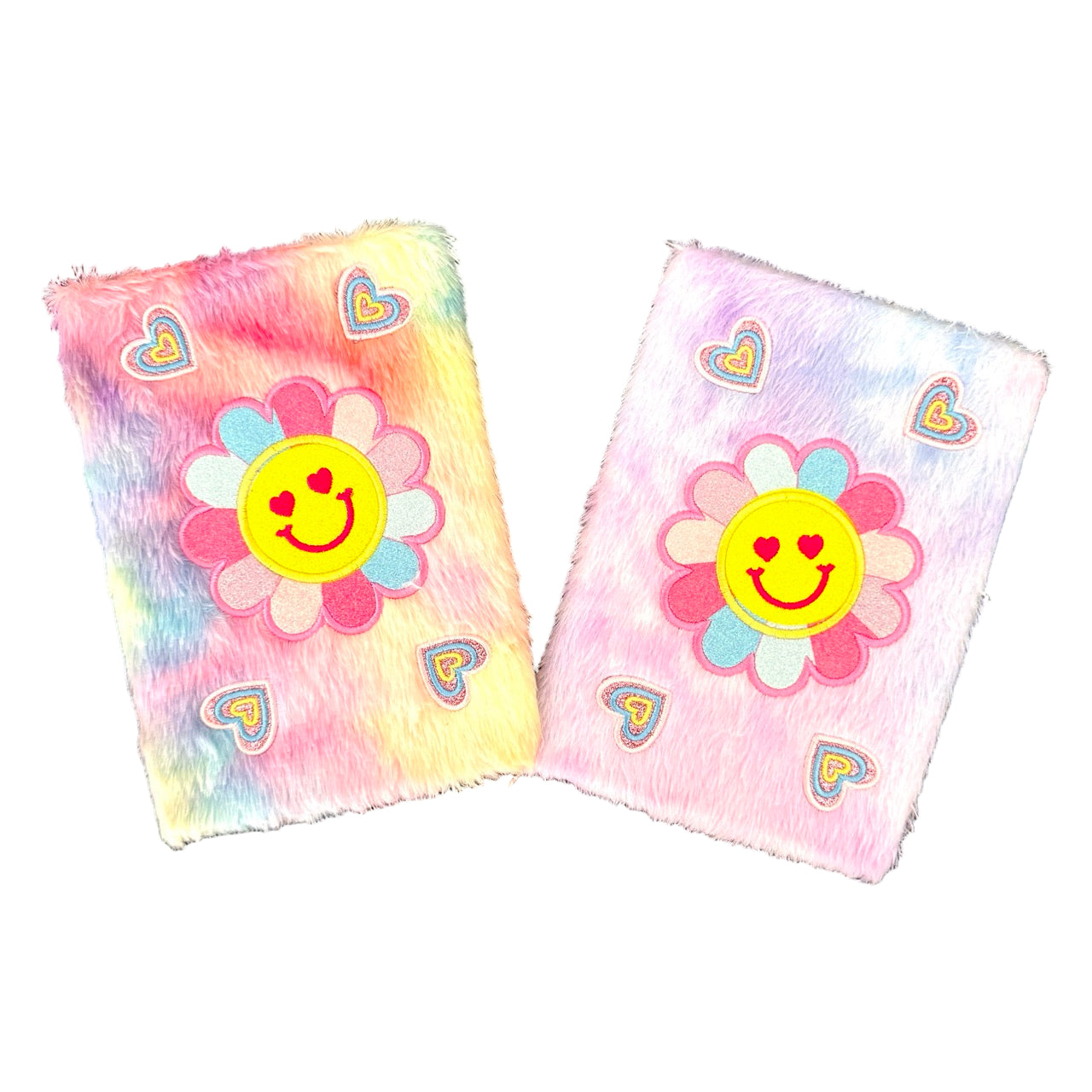 Two colorful journals with smiley face designs on a white background