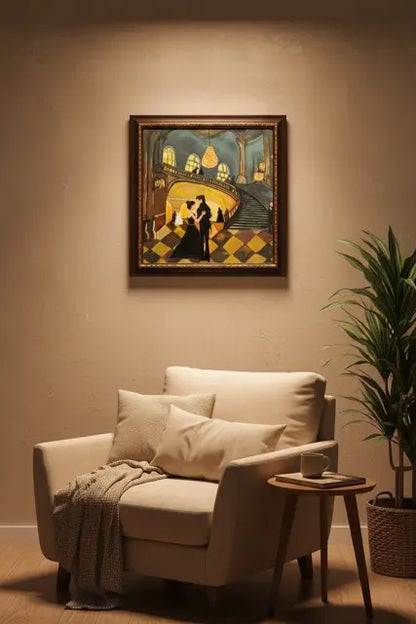 A framed art print depicting a dancing couple in a stylized, vintage illustration hangs on a beige wall above a cream-colored armchair with pillows and a throw blanket, next to a potted plant.