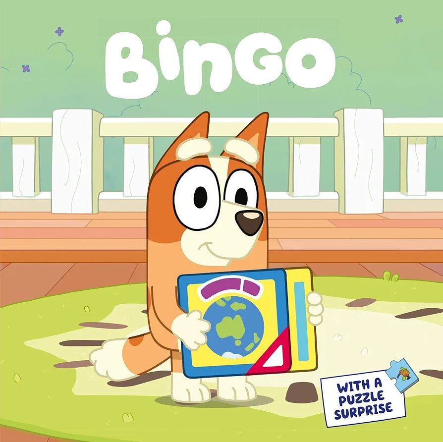 Cartoon dog character named Bingo holding a book with a puzzle surprise on a green background.