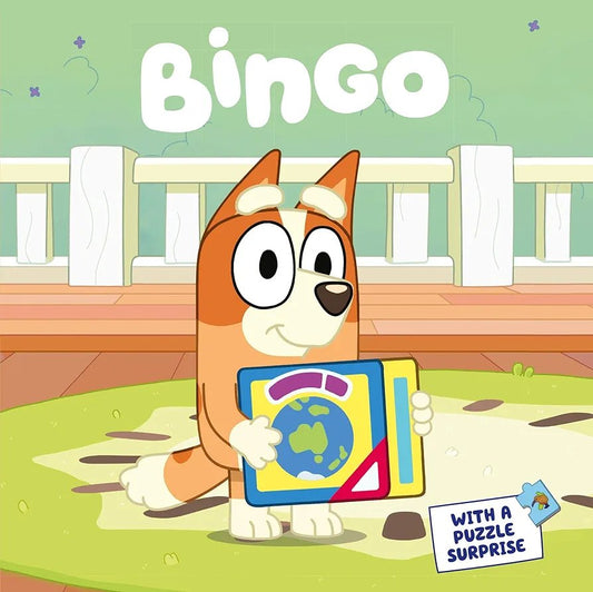 Cartoon dog character named Bingo holding a book with a puzzle surprise on a green background.
