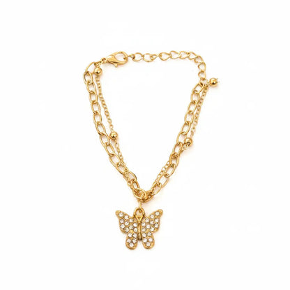 Gold chain necklace with a butterfly pendant on a white background