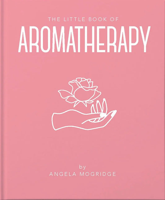 Pink book titled 'The Little Book of Aromatherapy' with a white rose illustration on a pink background