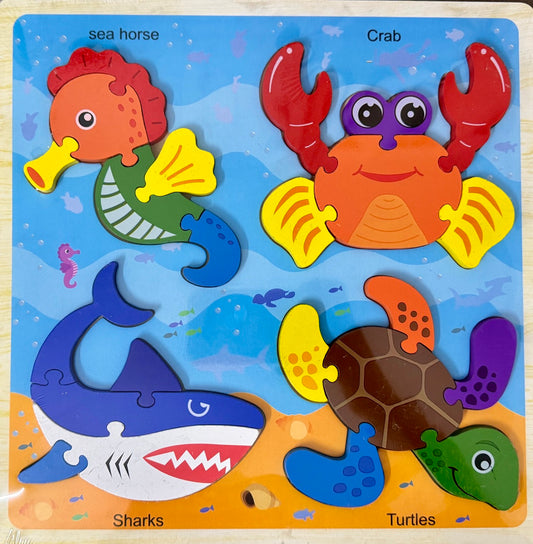 Children's puzzle with sea-themed figures including a sea horse, crab, shark, and turtle on a blue background.