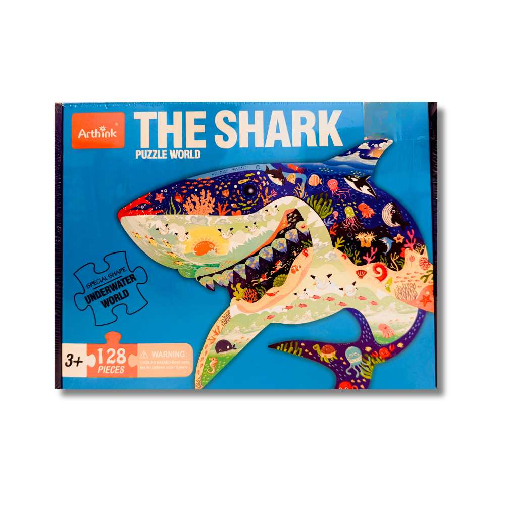 Puzzle packaging of a shark with colorful design on a blue background