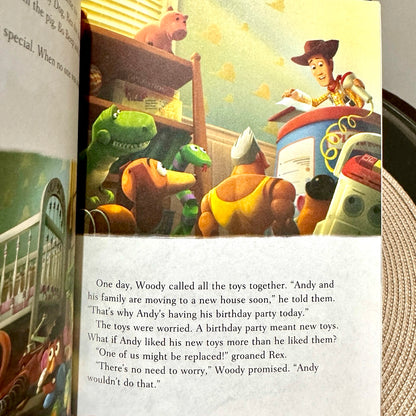 Illustrated book page with toy characters and text, featuring a scene from an animated movie.
