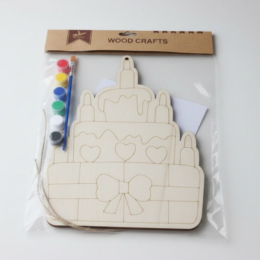 Wooden craft kit with castle design, paintbrushes, and markers on a white background